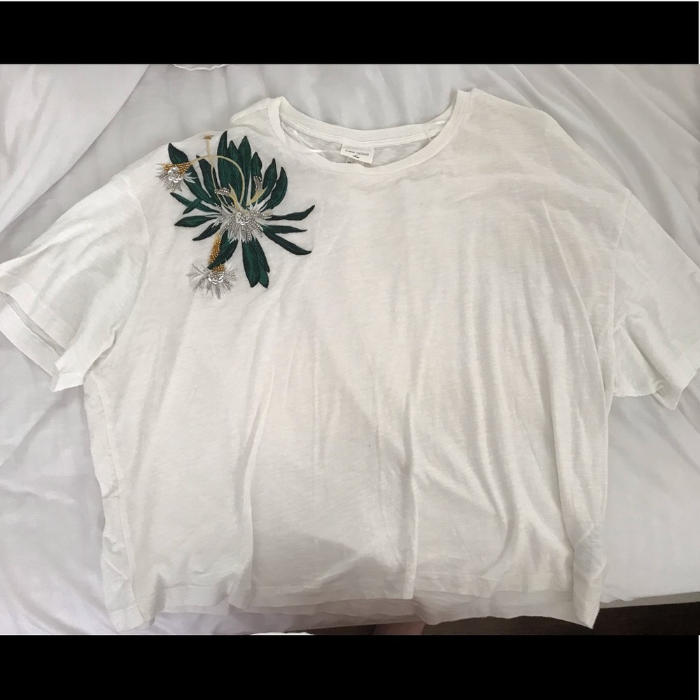 White tee with embellishment